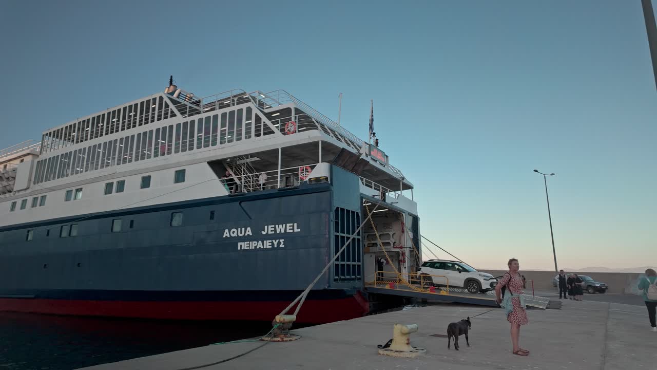 Vehicles disembark Greek car ferry boat docked Pelopennese port