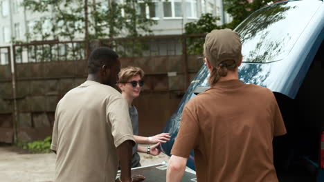 people carrying big box