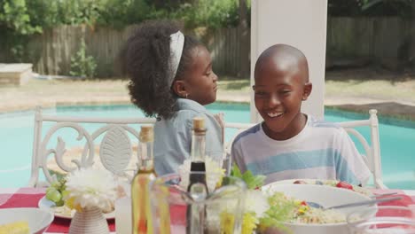 happy family eating together at table