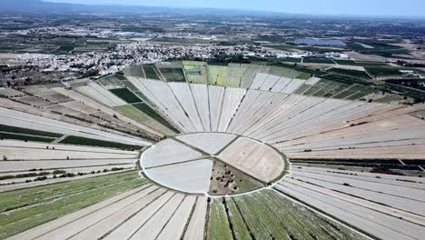 Aerial-view-of-the-circular-fields-of-the-drained-lake-of-Montady,-France,-Europe