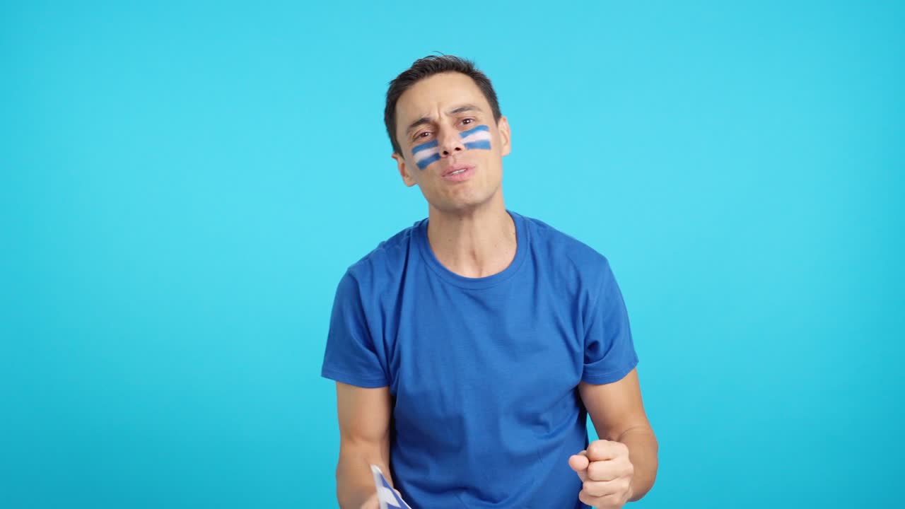 Man cheering for El Salvador during a match that is lost