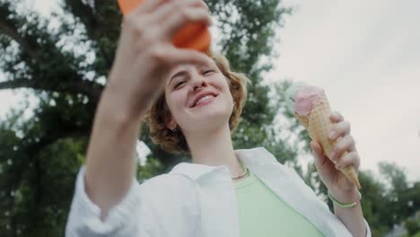 woman enjoying ice cream in a park