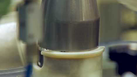 making piston for automobile engine in automobile factory, manually, close up