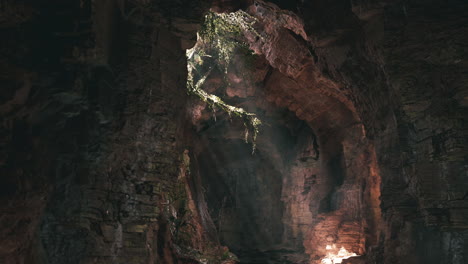 sunlight shining through a cave entrance