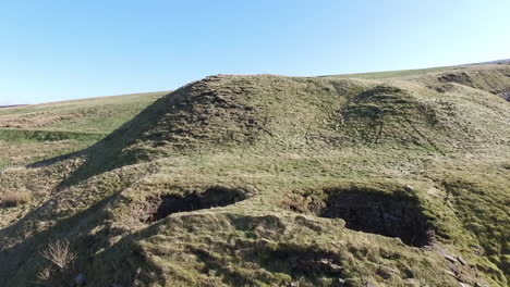 Rising-shot-of-some-disused-Lime-Kilns-beside-a-disused-Quarry-in-the-north-of-England-UK