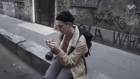 young traveler checks the message on the mobile phone