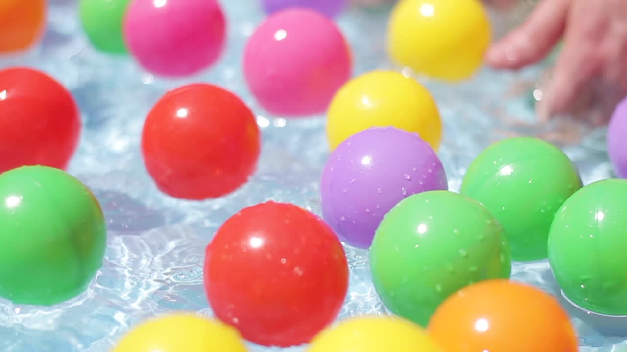 Balls Floating in Kiddie Pool