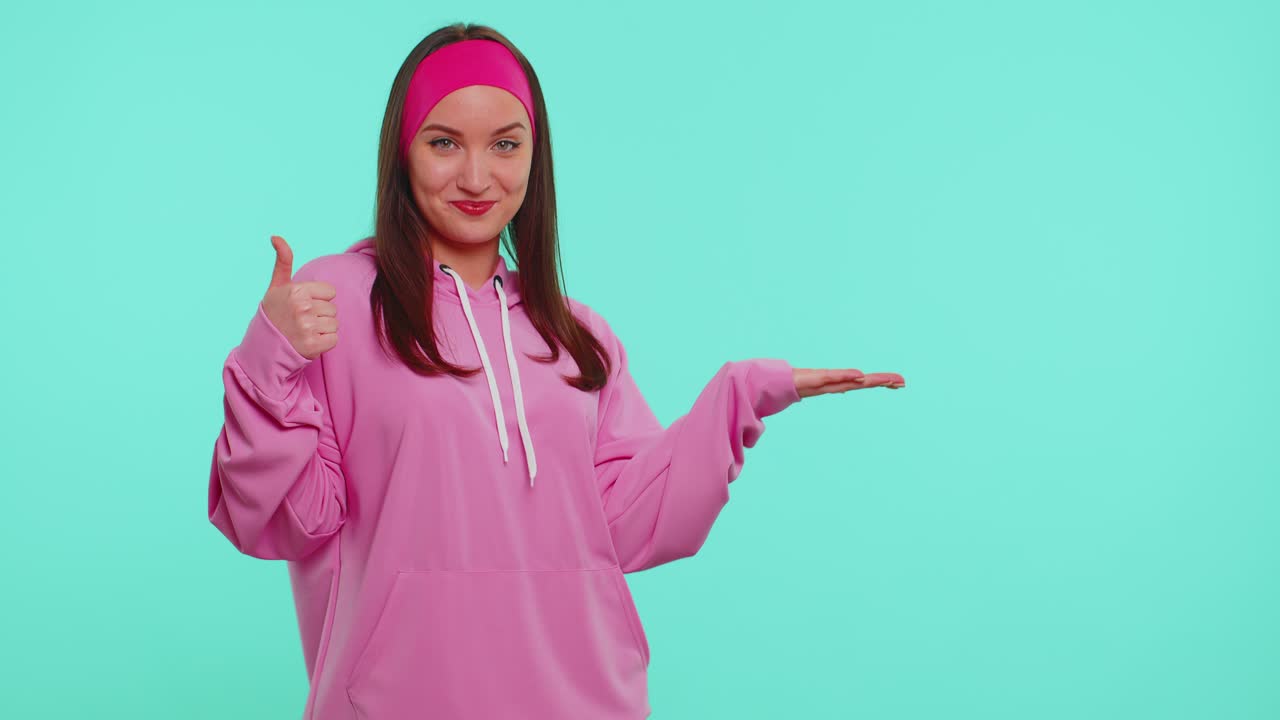 Girl pointing empty place advertising area for commercial text copy space for goods promotion