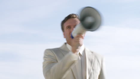 wealthy businessman speaking via electronic megaphone