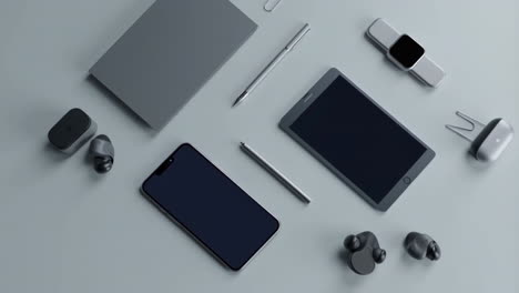 modern tech gadgets and office essentials flat lay on grey background