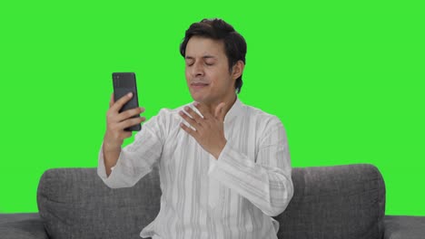 Angry-Indian-man-talking-on-video-call-Green-screen