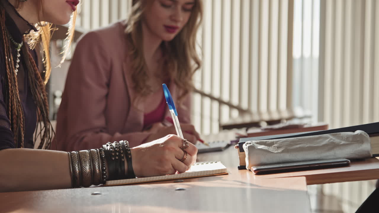 Female Gothic Student Taking Notes at Lesson