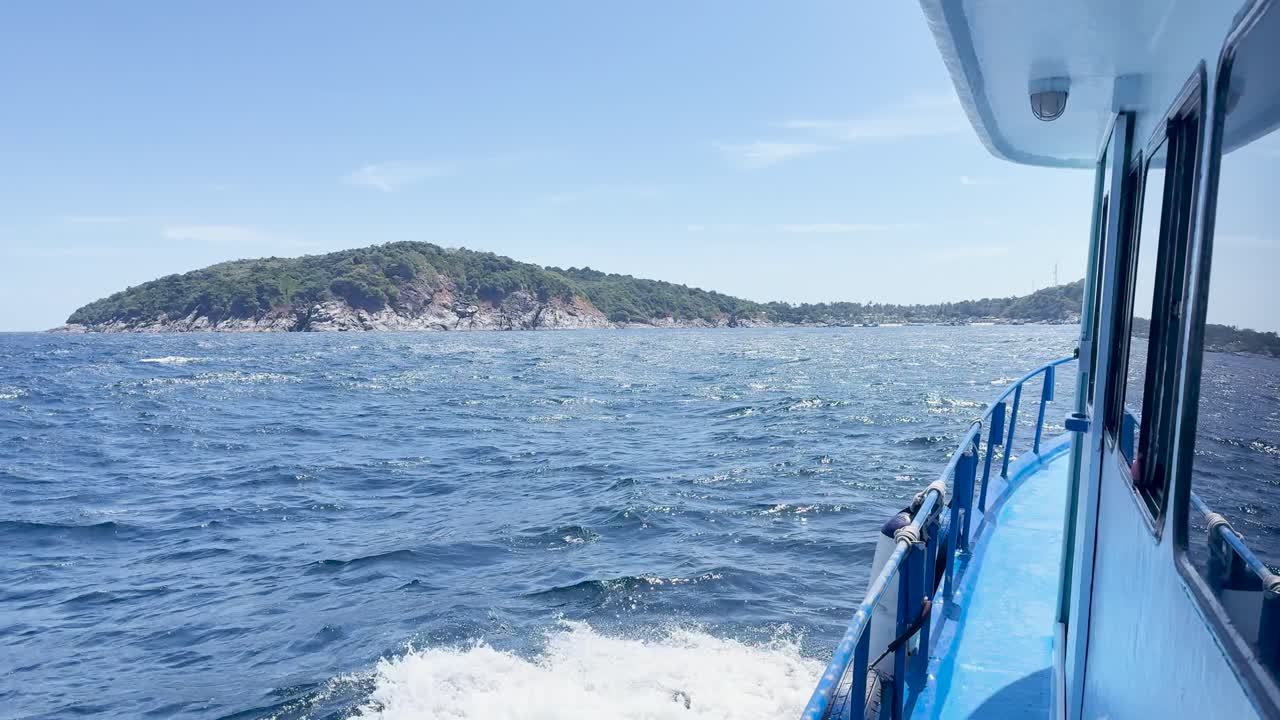 A boat navigates through rough seas near a lush island under clear skies, showcasing dynamic movement and vibrant colors