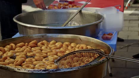 street vendor cooks and sells hot oil dough