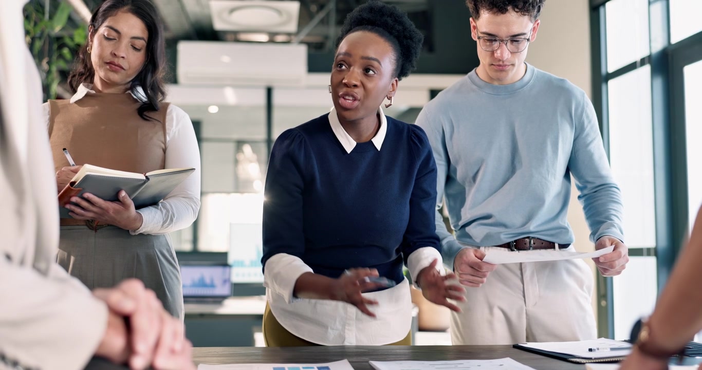 Diverse Business Team Collaborating in Modern Office Meeting