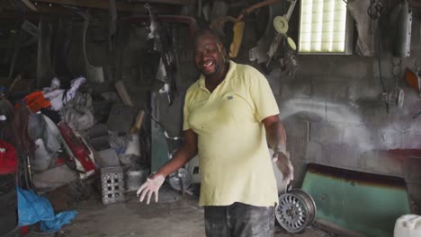 african handyman smiling at camera