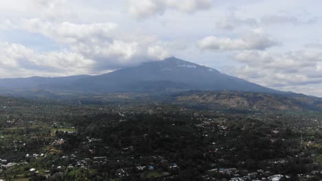 Birds-Eye-Aerial-View-of-African-Kids-Waving-at-Drone-in-Tanzania-Arusha