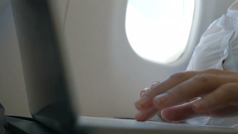 female hands typing in laptop