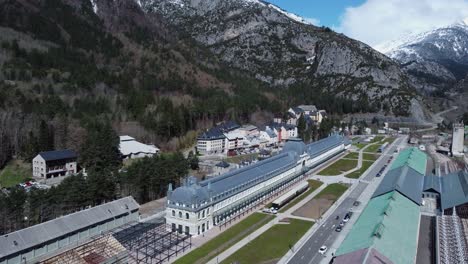 aerial rotates over classic train station in pyrenees mountains, spain