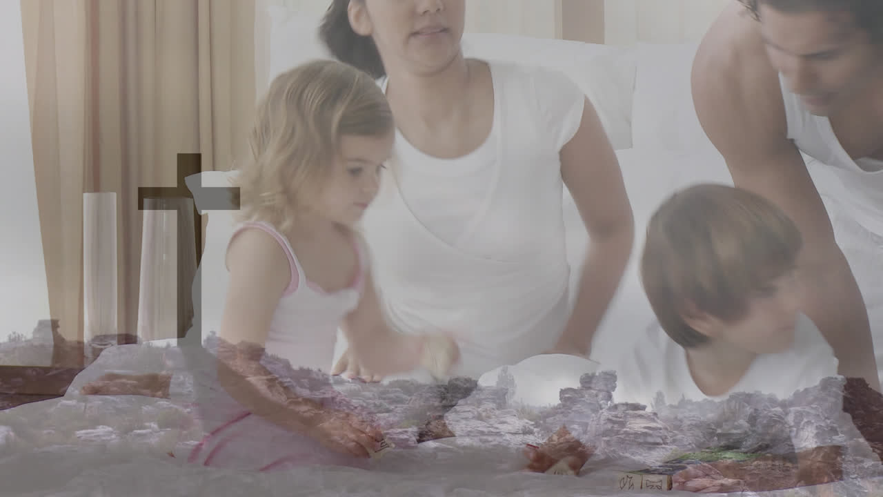 함께 놀고 있는 가족 위에 있는 기독교 십자가의 애니메이션