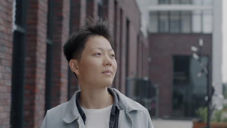 person looking away in city street