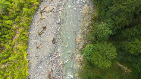 Overhead-drone-aerial-shot-of-mountain-river-in-Locarno-mountains,-Switzerland