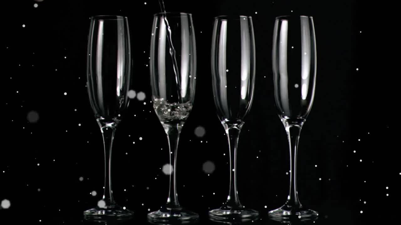 검은 바탕에 있는  ⁇ 페인 잔 위에 떠다니는  ⁇  반점들의 애니메이션