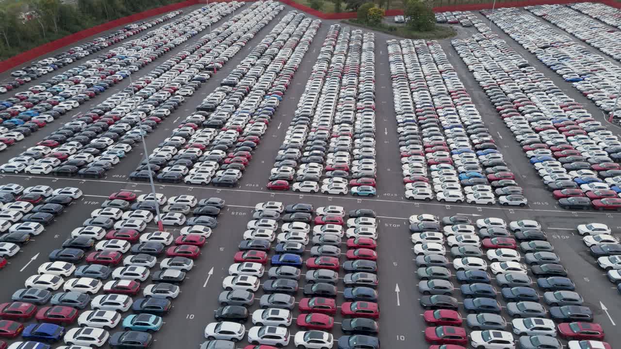High-angle view of vast car storage facility at Royal Portbury Dock, showing systematic arrangement of newly imported vehicles, Bristol, UK