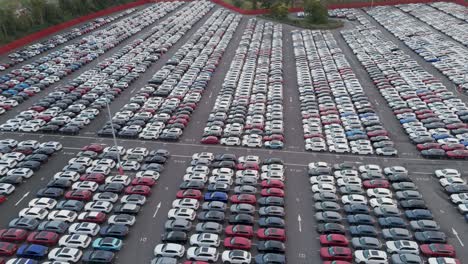 high-angle view of vast car storage facility at royal portbury dock, showing systematic arrangement of newly imported vehicles, bristol, uk