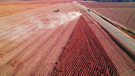 Harvesting-soybeans-using-a-Soybean-combine-harvester-in-rural-Georgia,-USA-close-to-road