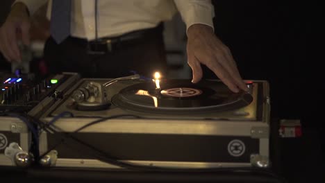 dancing dj mixing vinyl board, close up