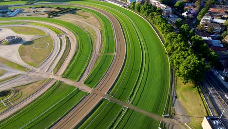 drone aerial view of royal randwick racecourse races horse racing sport grass field track gambling fencing path course nsw randwick coogee sydney city australia 4k