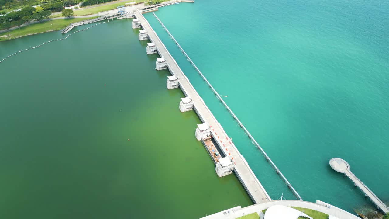 Aerial view over Singapore Marina Barrage, port of Singapore water dam, panoramic scene showcases the dynamic convergence of modern engineering and natural beauty