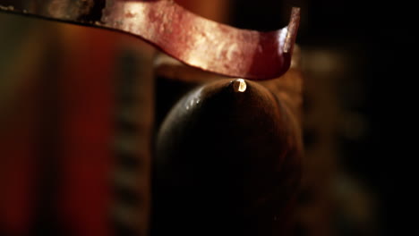 close-up of blacksmith working on a iron rod