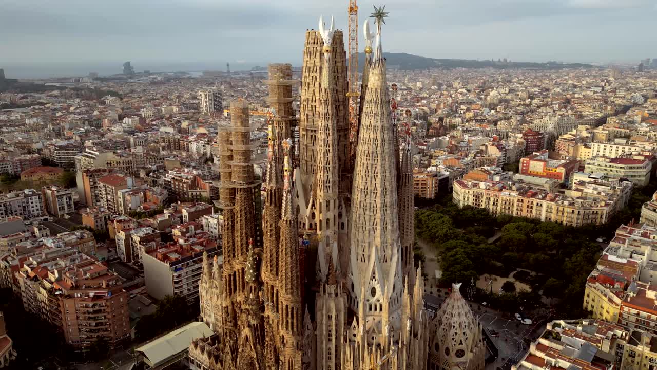 Extreme close-up of La Sagrada Familia Iconic Tower and Barcelona cityscape