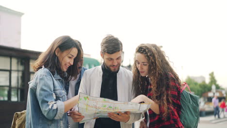 friends exploring city with map