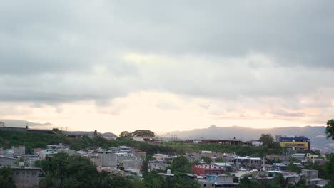 Landscape-of-a-poor-neighborhood-in-Tegucigalpa,-Honduras,-during-a-winter-sunset