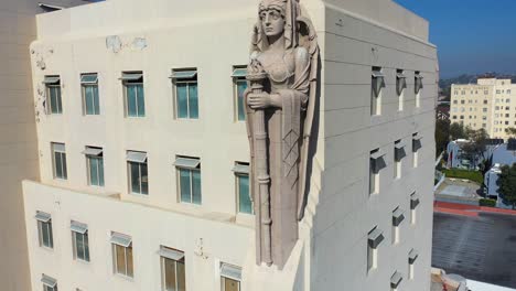 Aerial-Of-The-Macarthur-Building-In-Los-Angeles-With-Elaborate-Warrior-And-Angel-Friezes-And-Sculpted-Figures-Overlooking-The-City-2