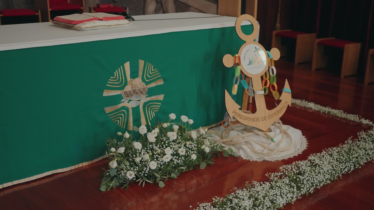 Sacred altar adorned with symbolic wooden anchor and delicate white blooms