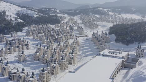 abandoned mall and a lot of fairy like disney castles in snow at failed property development turkey