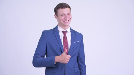 happy young handsome businessman in suit