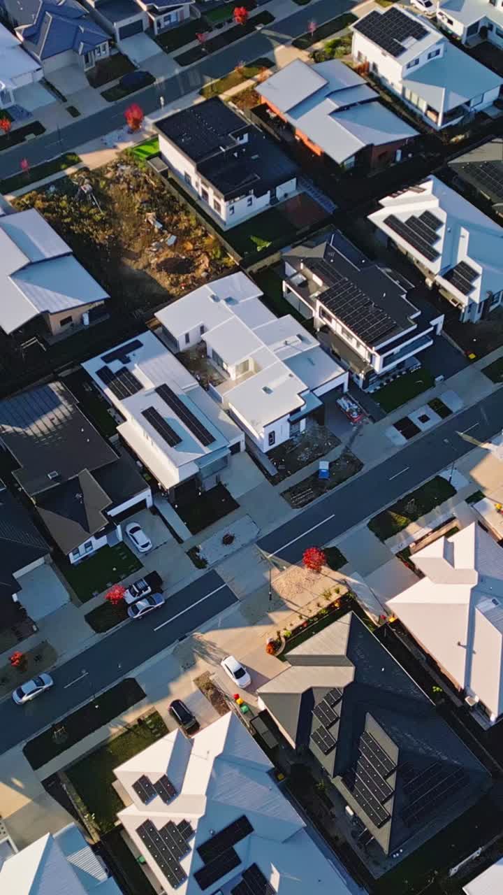 Vertical drone birds eye view looking down at newly built houses with solar panels in new Whitlam suburb, Canberra. Sustainable housing development with renewable energy addressing Australia's housing
