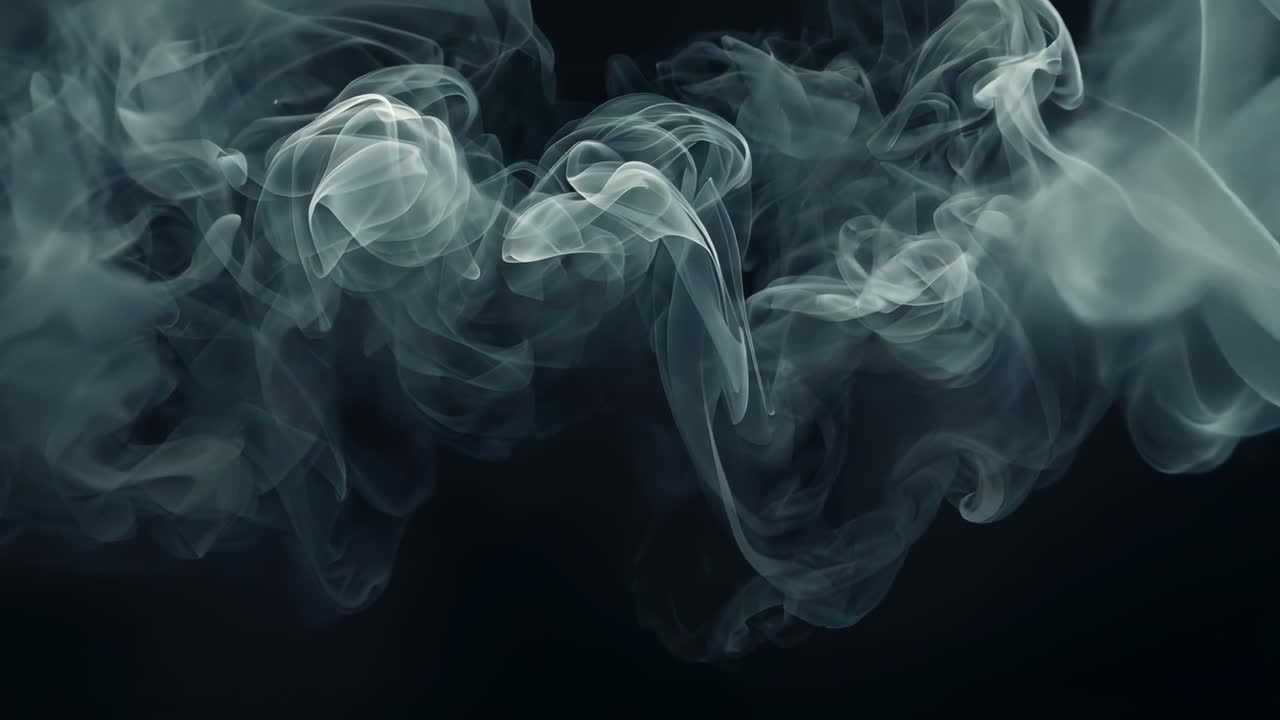 Drifting translucent smoke wisps twisting into layered curls in studio, with dark backdrop