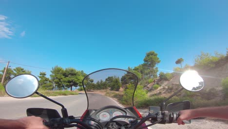 riding a motorcycle on penteli mountain in greece