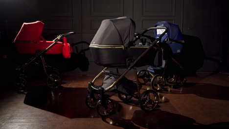 luxury baby strollers in red, blue, and black