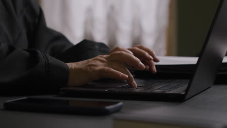 woman typing on laptop