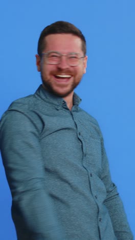 amused smiling cheerful mature man laughing out loud funny ridiculous joke anecdote bullying abuse