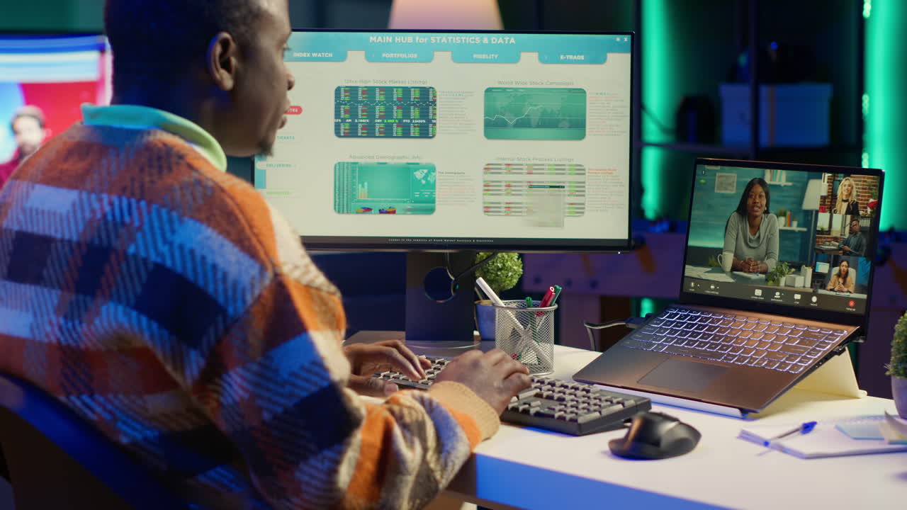 Man Analyzing Stock Market Data on Computer with Video Call