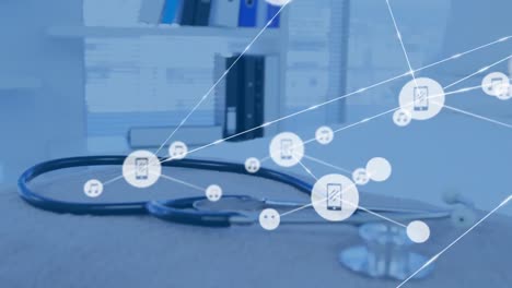 animation of network of digital icons against close up of a stethoscope on desk