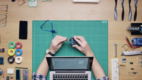 top view software engineer hands coding  at desk from above - red epic dragon